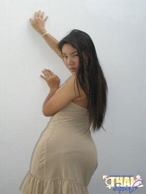 Asian shemale Angel posing in dress and high heels