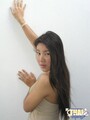 Hands pressed against wall black hair tumbling down back