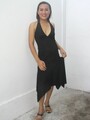 Lifting hem of dress wearing black heels