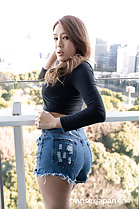 Matsushita Rui looking back hand on hip in shorts